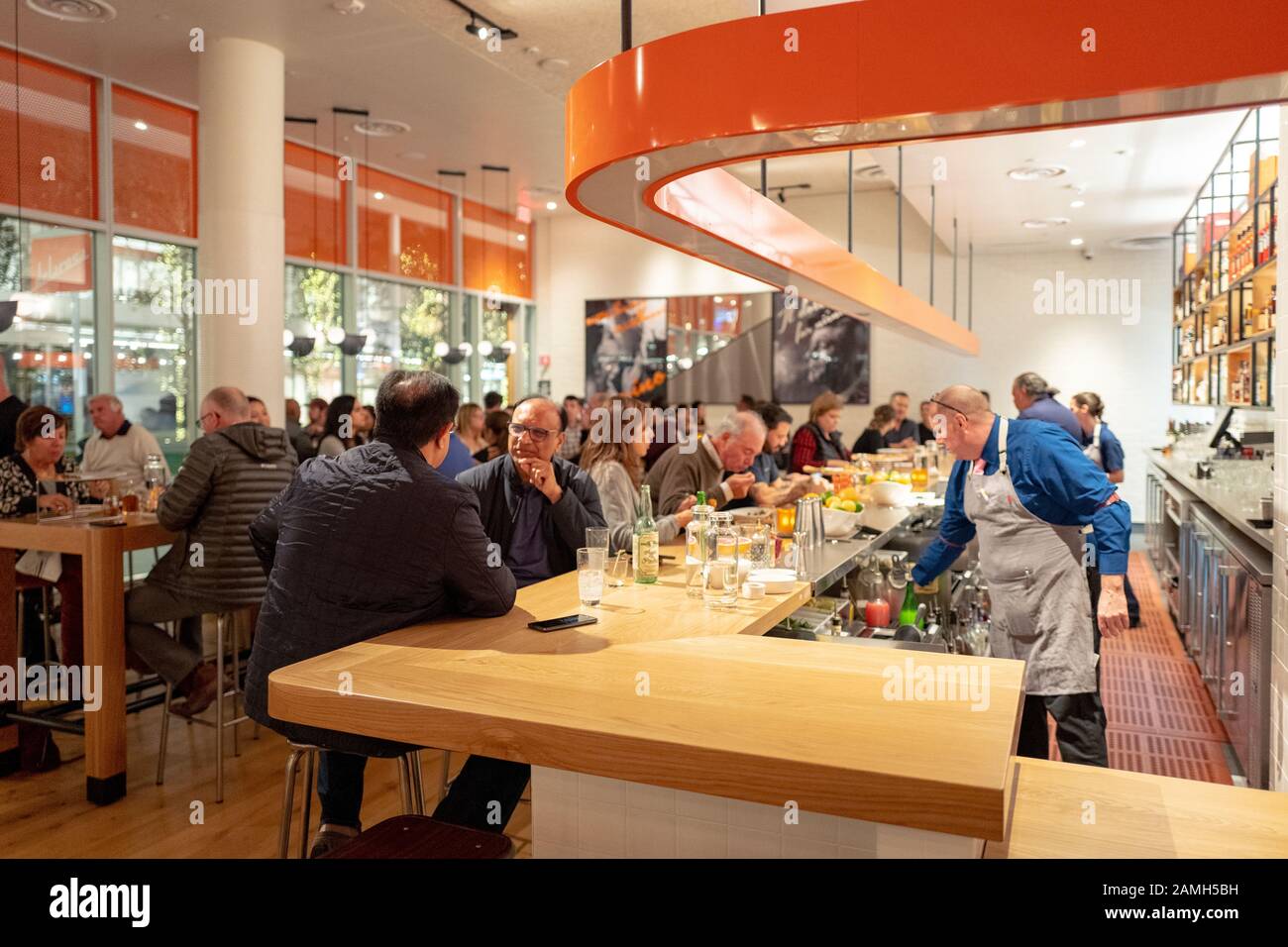 Interior of restaurant during grand opening event at Delarosa
