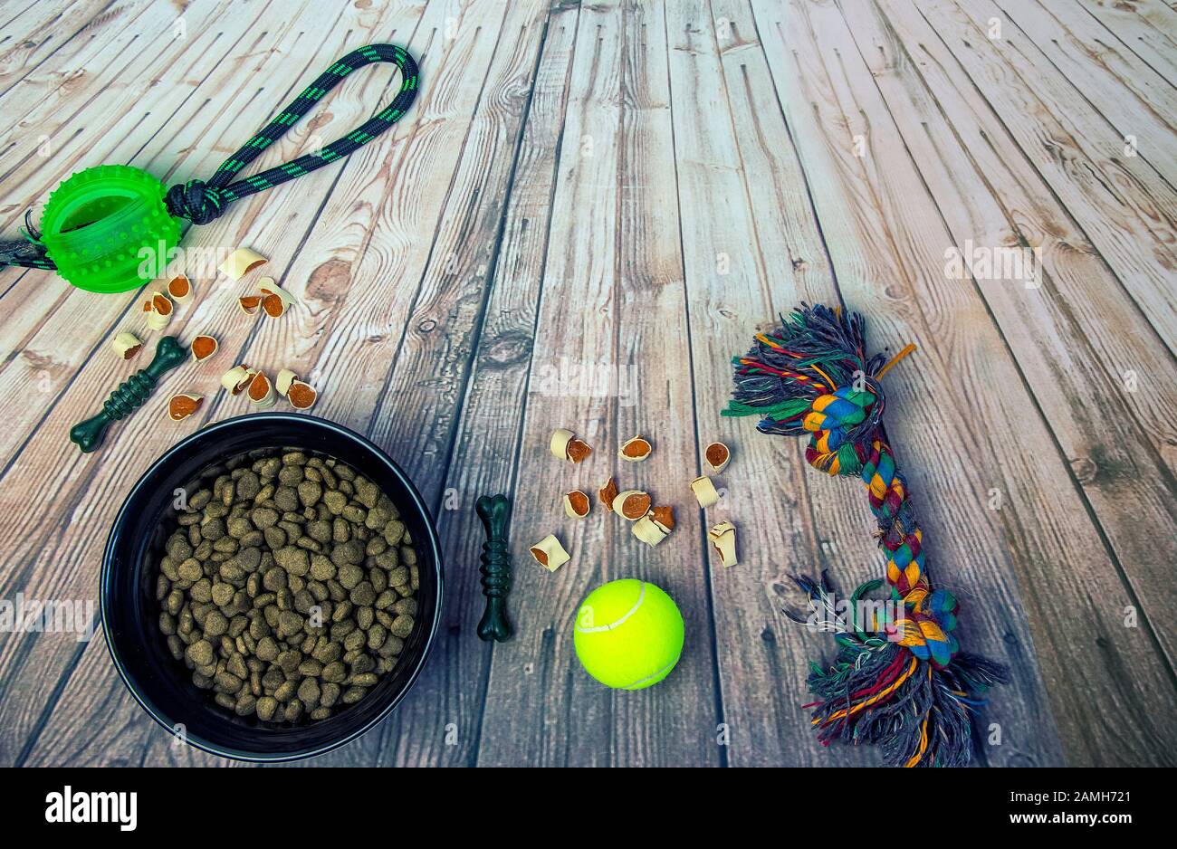 Dog bowl with food drag and drop and tennis ball Stock Photo Alamy