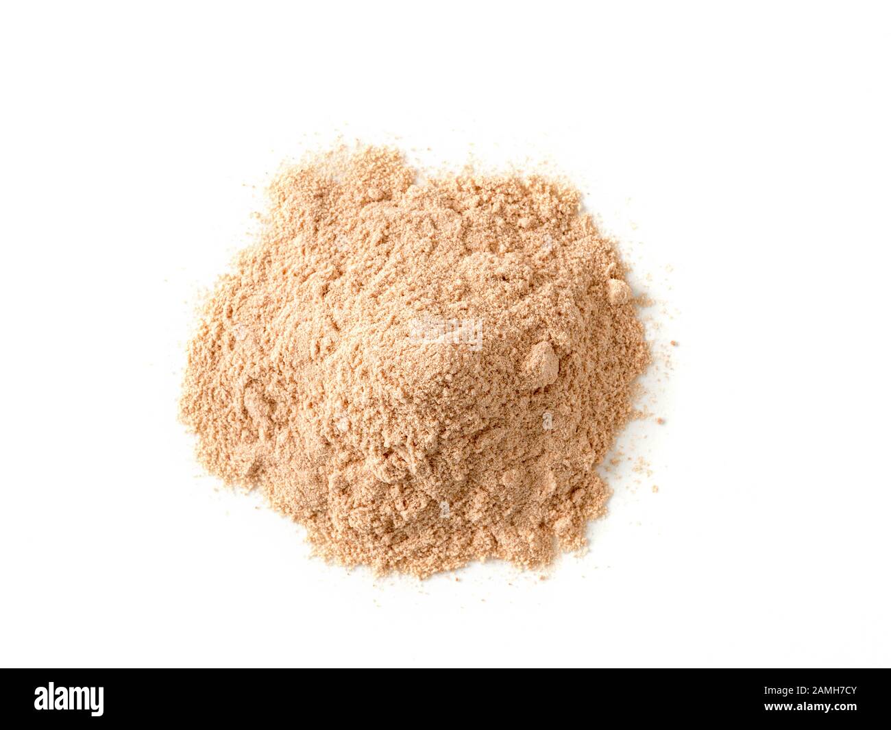 Lucuma powder heap isolated on white background. Natural low glycemic sweetener Pouteria Lucuma, top view or flat lay. Isolated with clipping path. Stock Photo