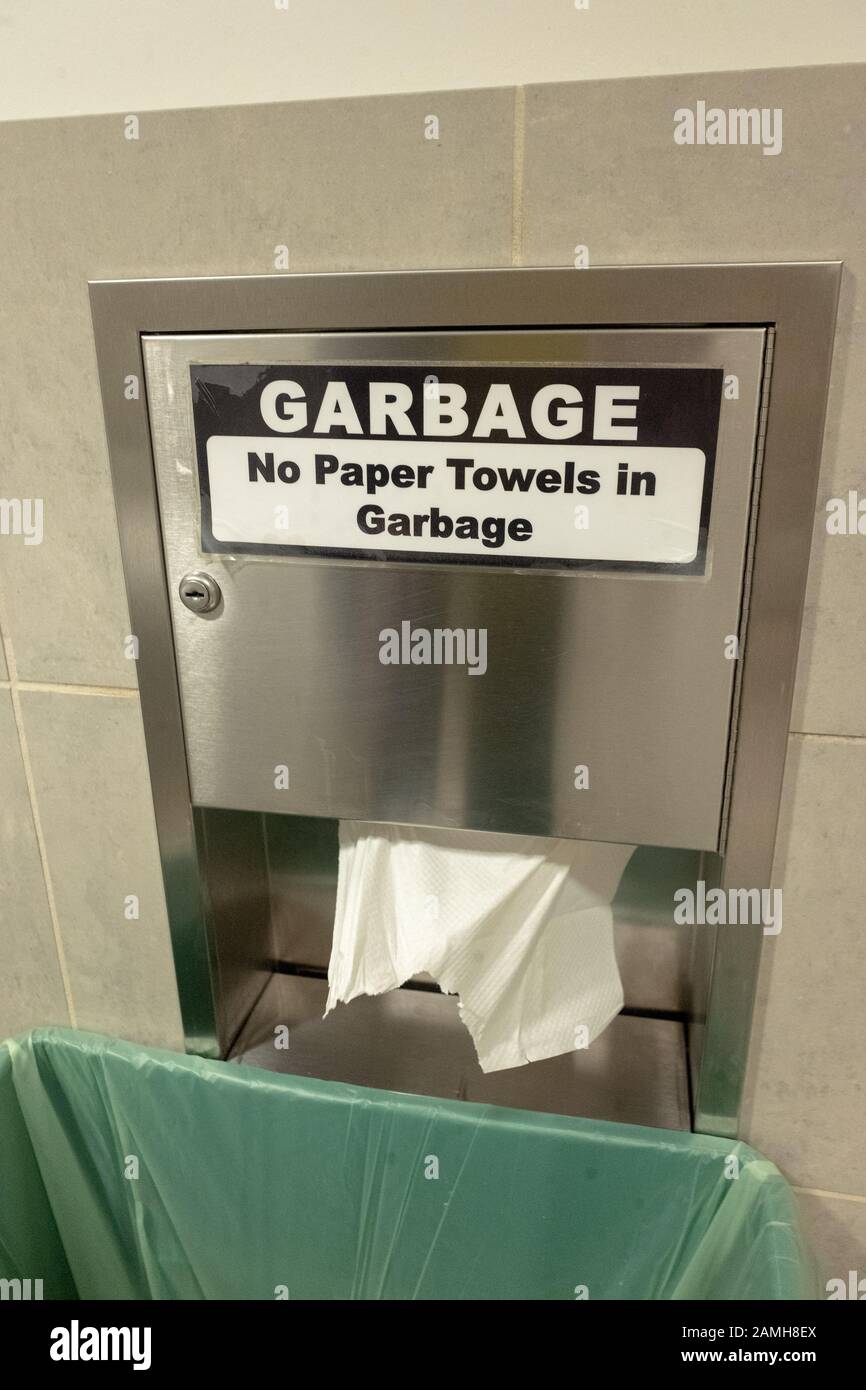 Closeup of paper towel dispenser and bin for composting paper towels