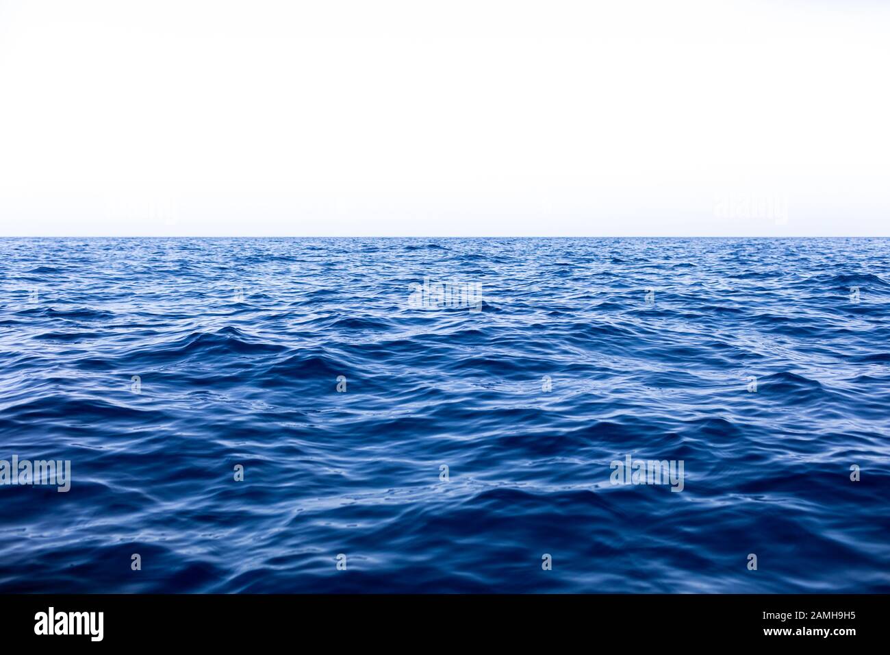 Calm Sea Ocean And Blue Sky Background Stock Photo - Alamy