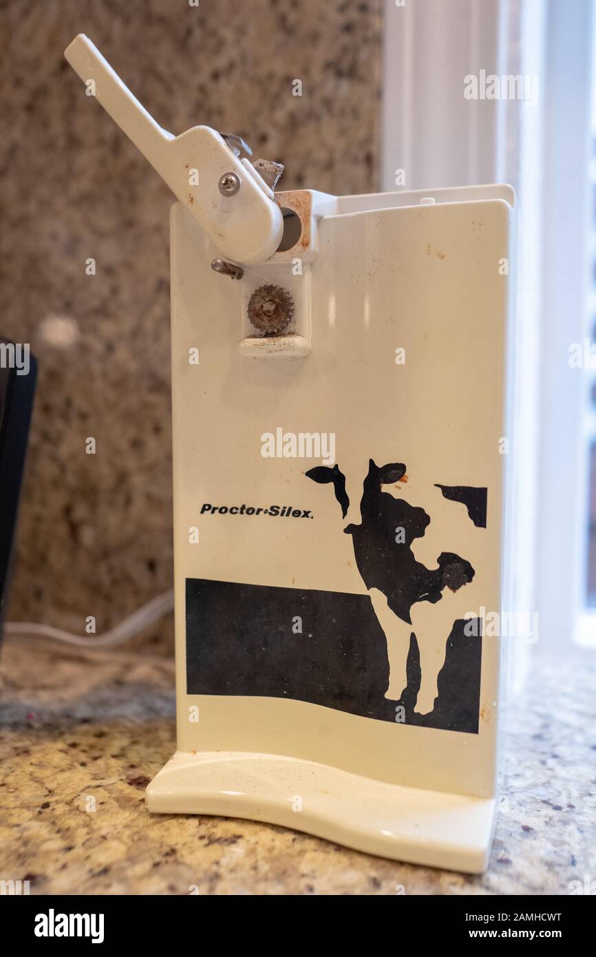 https://c8.alamy.com/comp/2AMHCWT/close-up-of-vintage-kitchen-appliance-an-electric-can-opener-from-proctor-silex-ca-1980s-and-1990s-with-cow-motif-december-12-2019-2AMHCWT.jpg