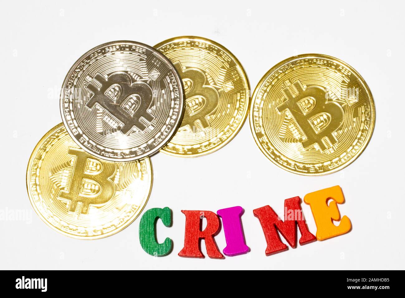 Cryptocurrency crime concept. Bitcoin on white background flat lay Stock Photo