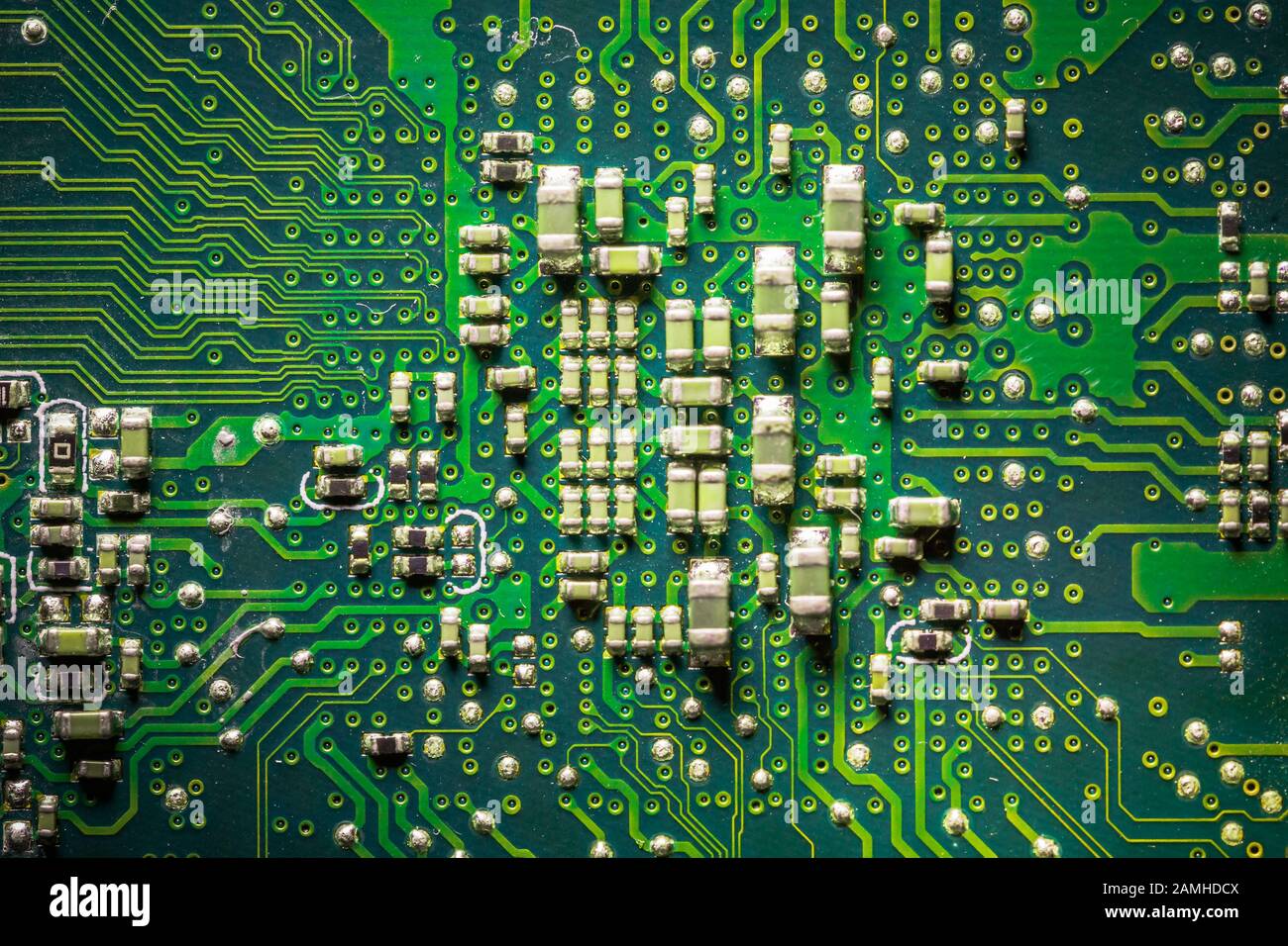 Close-up board with micro chips from an electrical appliance or computer. Concept of modern technology. Concept of electronics and microchips. SMD Stock Photo