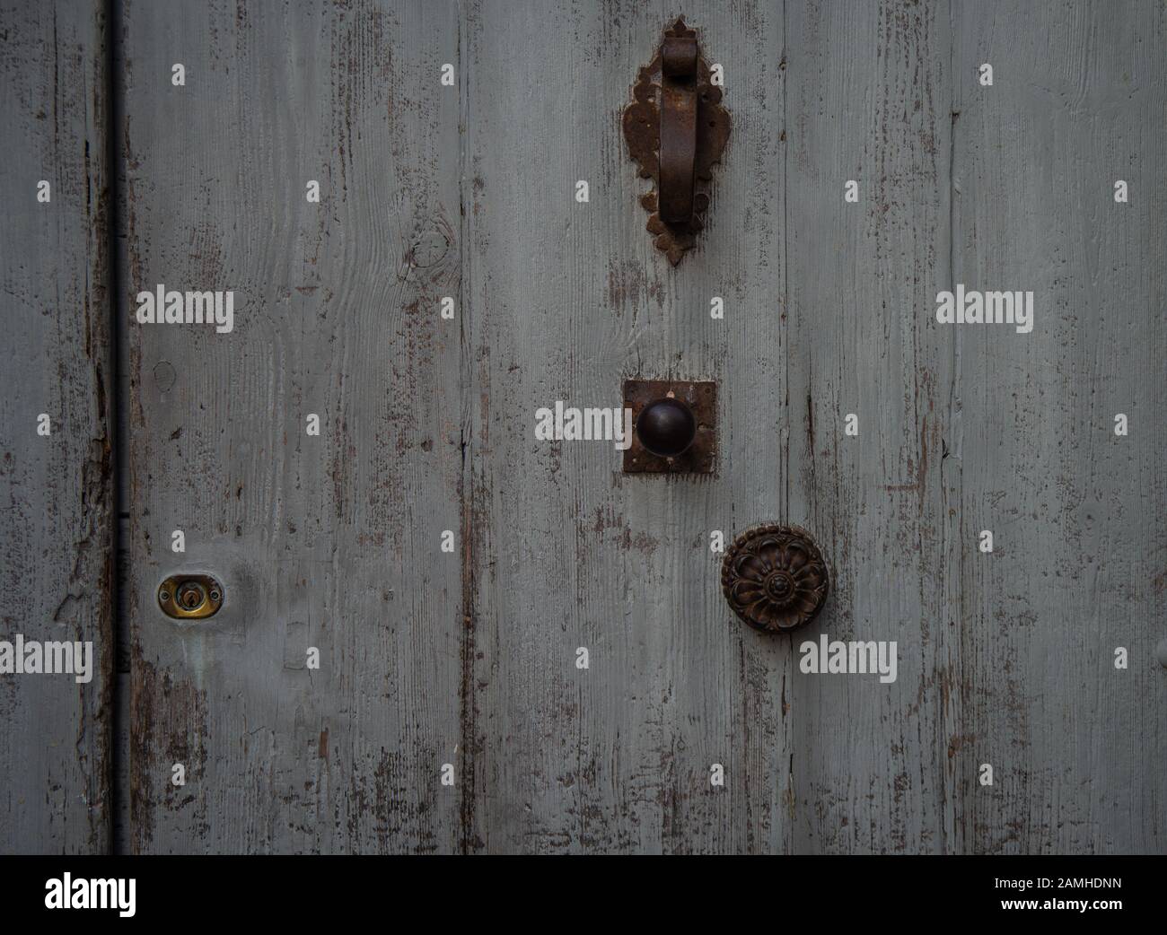 grey blue  old  French door ,with knocker & handle.,texture ,background. Stock Photo