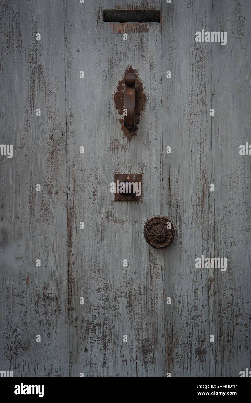 grey blue  old  French door ,with knocker & handle.,texture ,background. Stock Photo