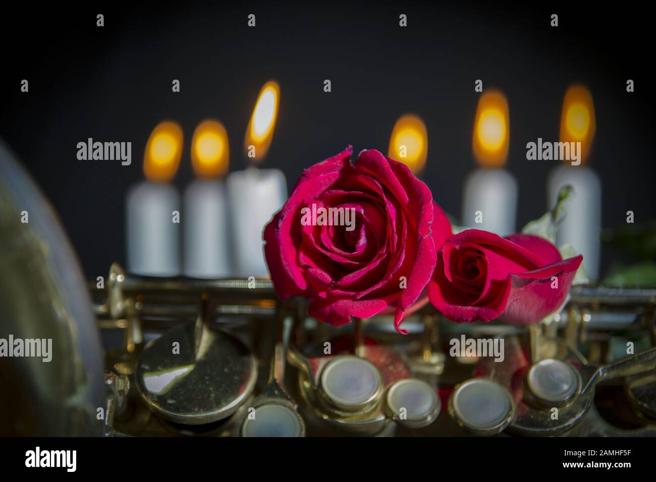 Red Roses And Saxophone red rose in black background.smoke and candles .romantic flower saint ...