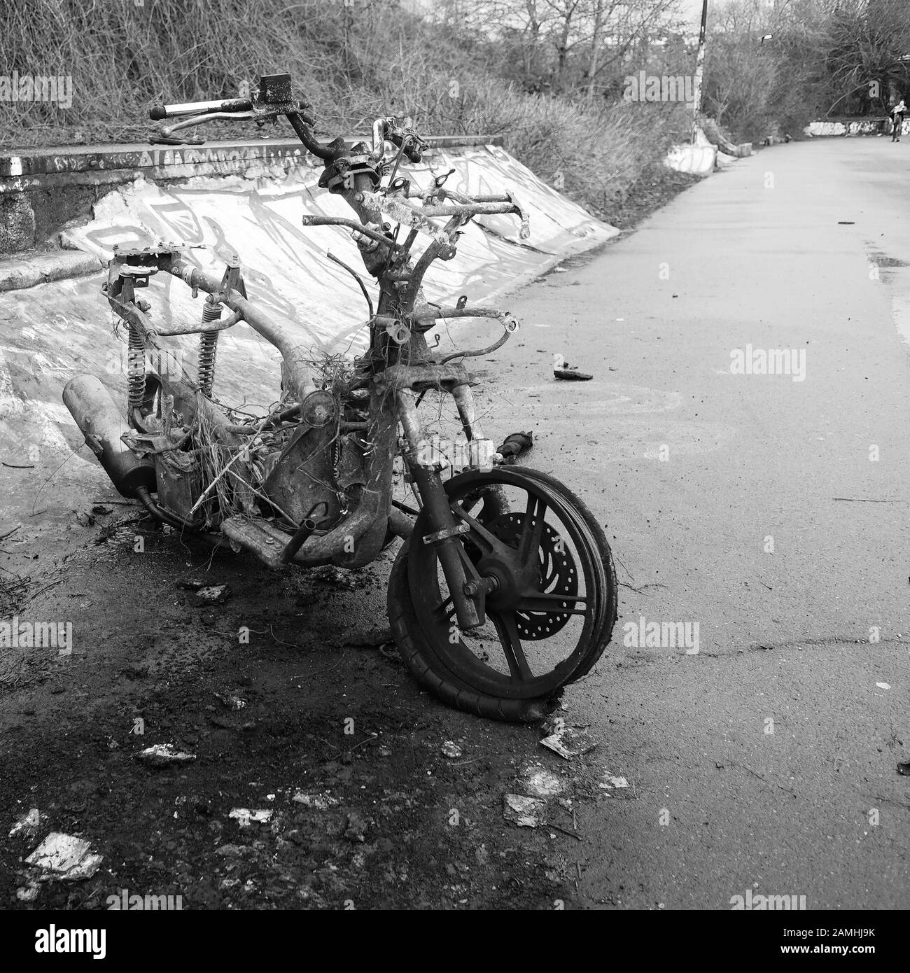 January 2020 - Burnt out scooter in Bristol on a cycleway Stock Photo