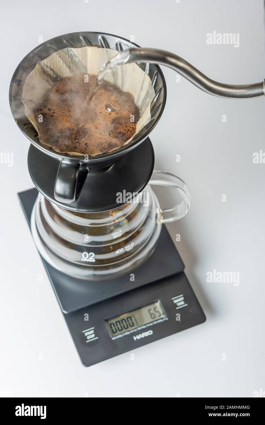 Brewign third wave coffee with chemex glass and drip kettle for pure flavor  in good design on wooden table Stock Photo - Alamy