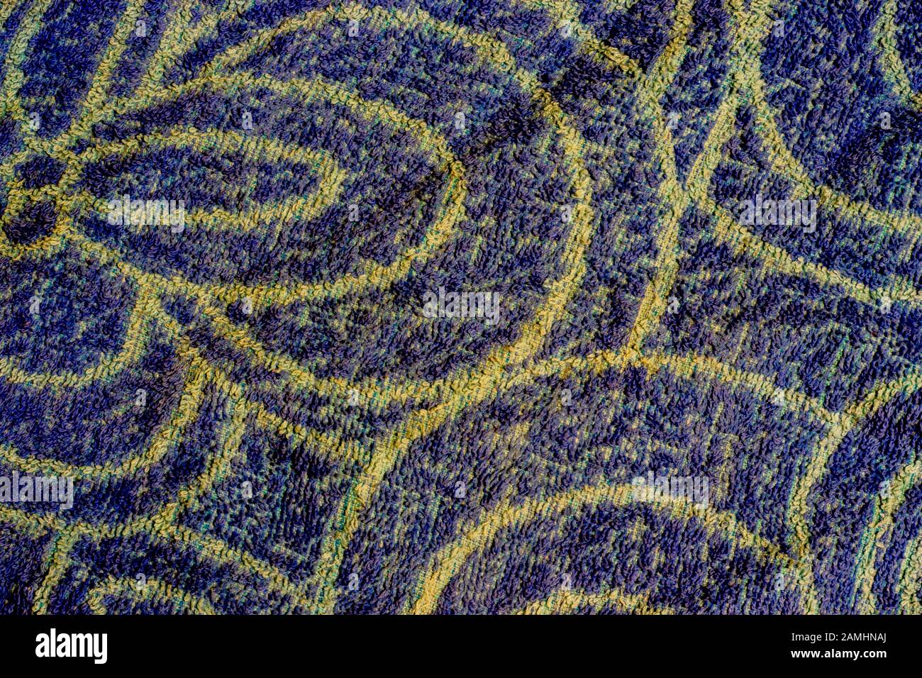 Blue woven texture with yellow patterns. Background with copy space Stock Photo