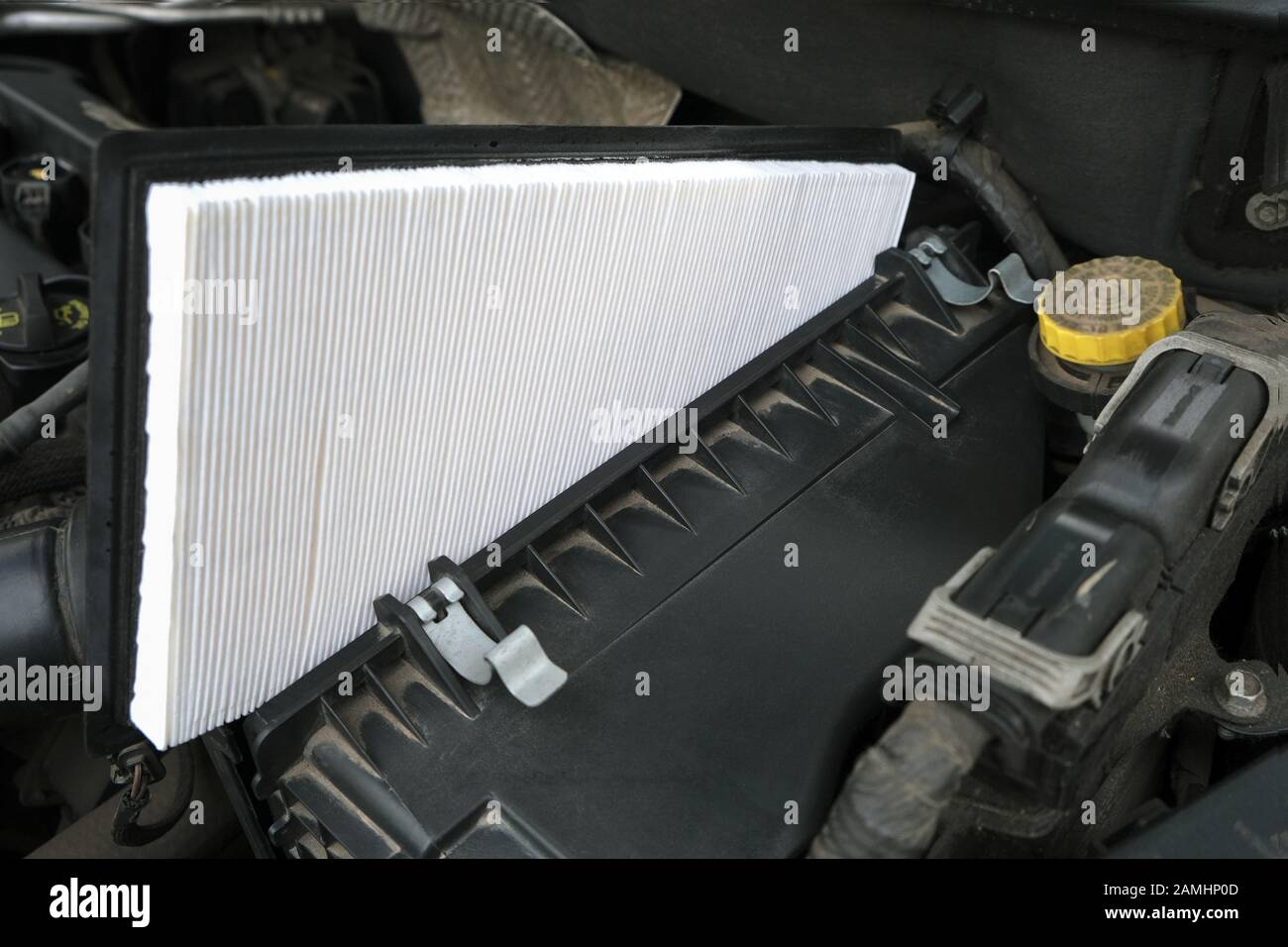 Vehicle maintenance, new fresh Intake air filter, car servicing and repair engine procedure Stock Photo