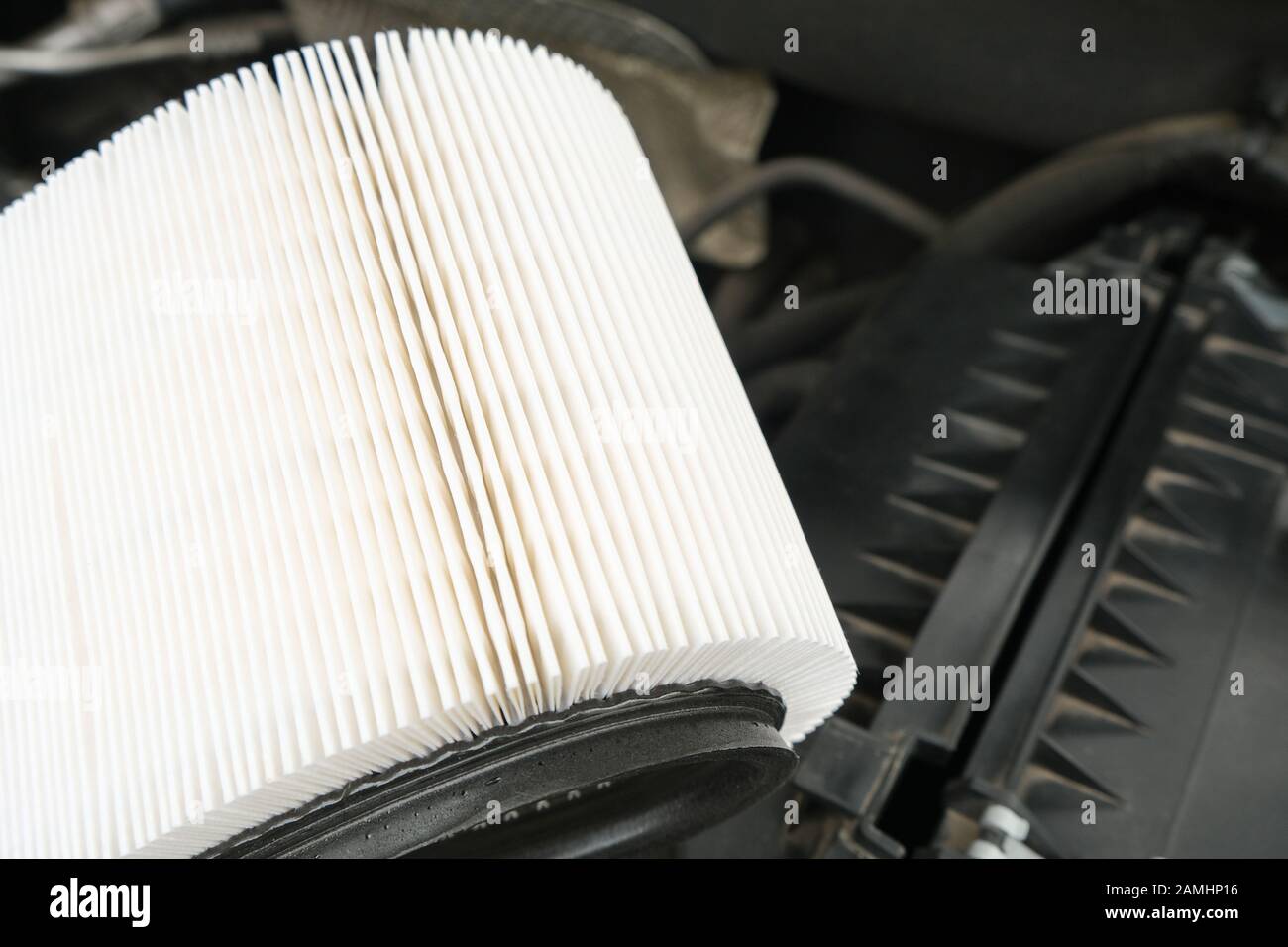 white new fresh Intake air filter, vehicle maintenance, car servicing and repair engine procedure, copy space for text Stock Photo
