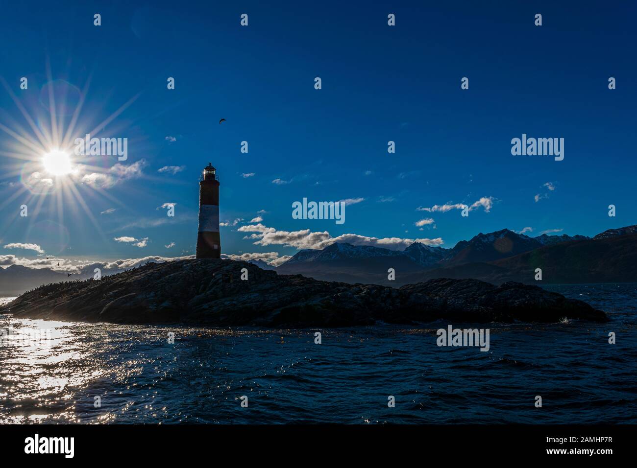 Les Eclaireurs Lighthouse Silhouette against sunlight rays at the end ...