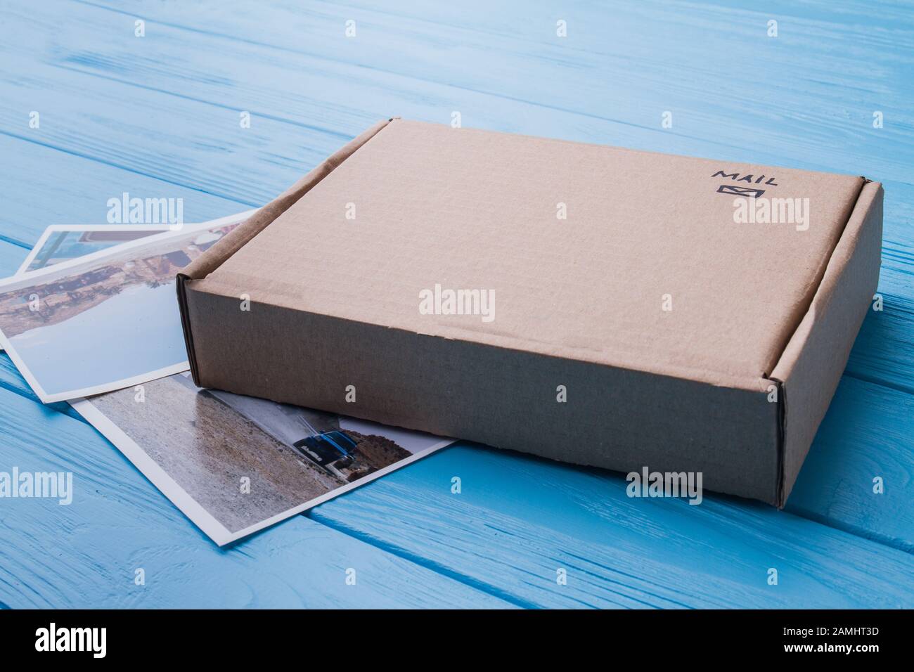 Cardboard carton box with photos, close-up Stock Photo - Alamy