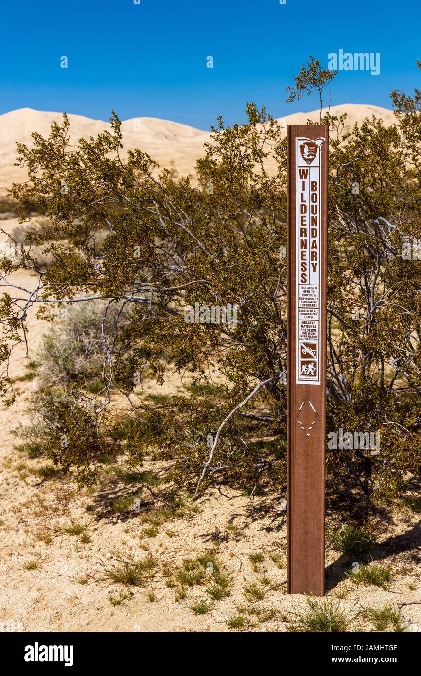 National Park service Sign indicating the wilderness boundary at the Kelso Sand dunes in Mojave National preserve, California, USA Stock Photo