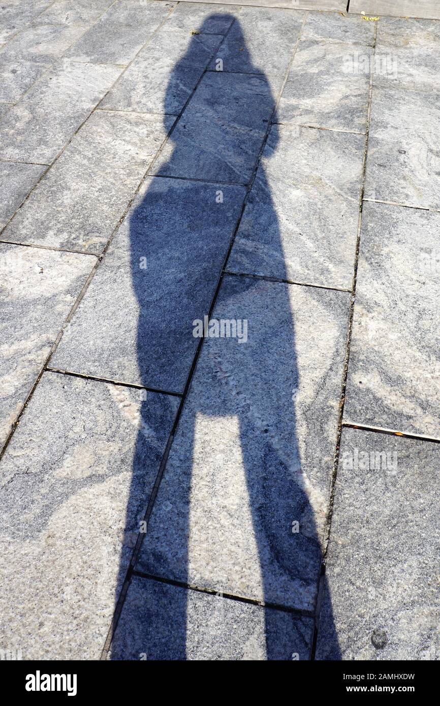 A person's shadow on hard surface Stock Photo