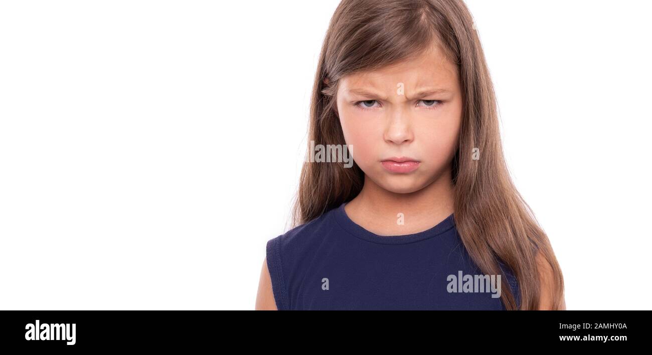 Angry baby girl on white background. Stock Photo