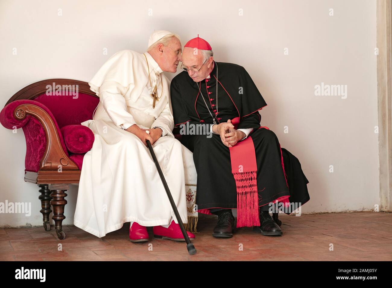 The Two Popes (2019) directed by Fernando Meirelles and starring Anthony Hopkins as Pope Benedict and Jonathan Pryce as Cardinal Jorge Bergoglio who becomes Pope Francis. Stock Photo