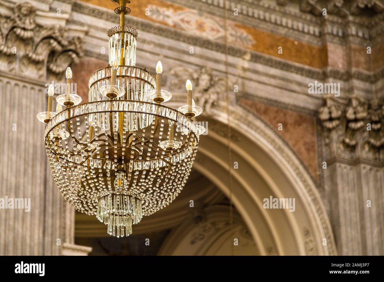 Crystal chandelier hanging from roof in luxury house Stock Photo Alamy