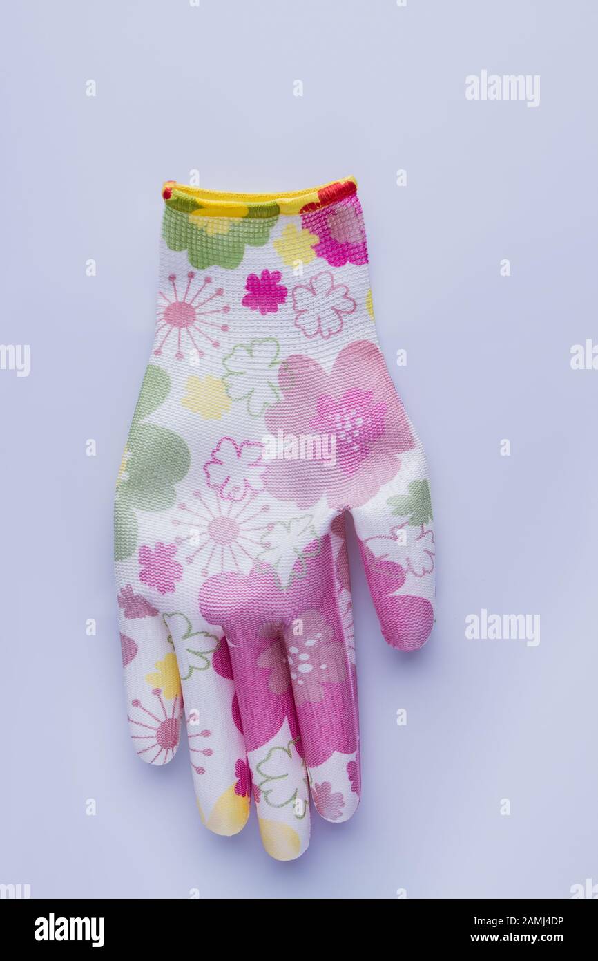 Female protective colorful garden glove. Stock Photo