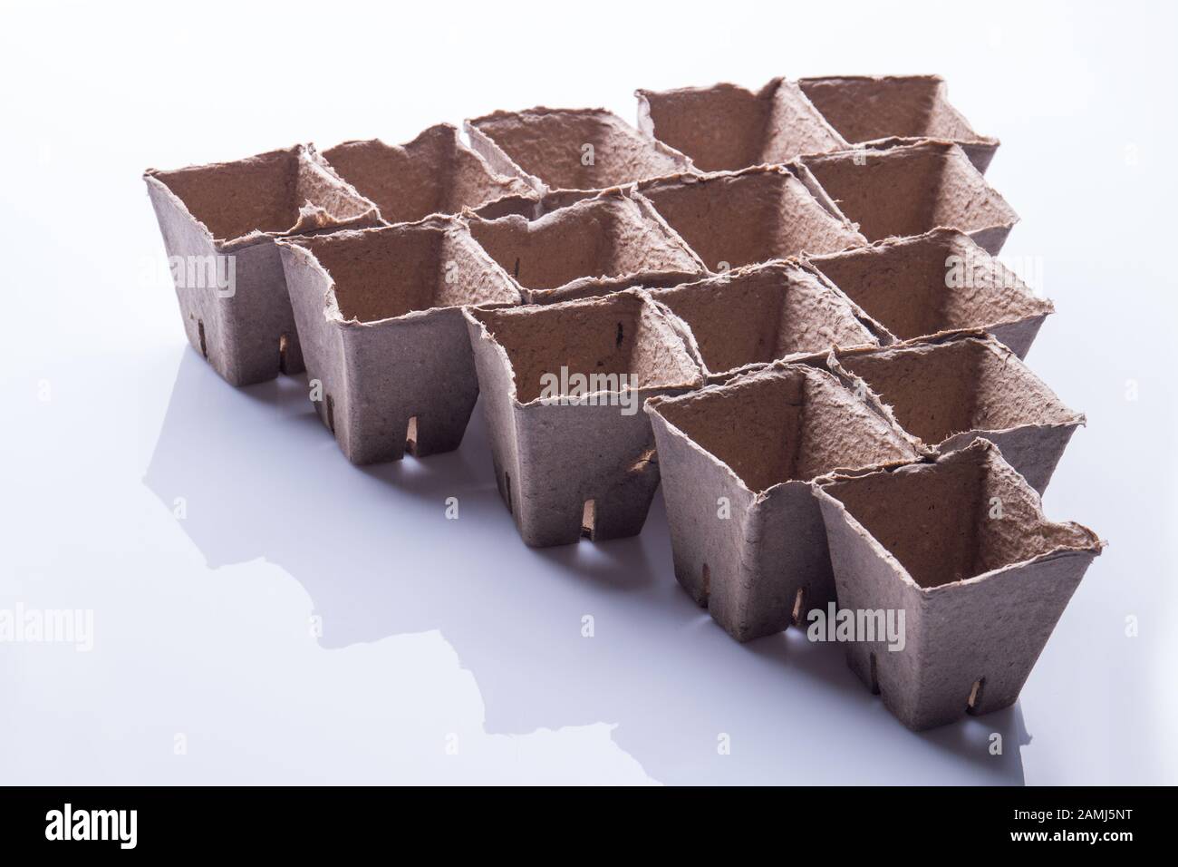Cardbaord fibre containers arranged in a tringle Stock Photo Alamy
