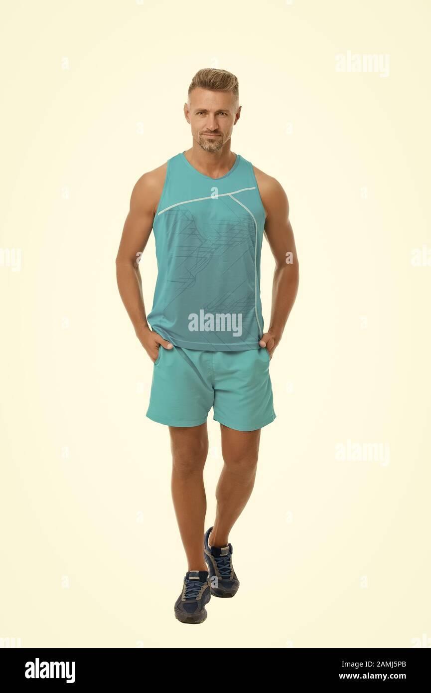 Guy sport outfit. Fashion concept. Man model clothes shop. Sport style.  Menswear and fashionable clothing. Man calm face posing confidently white  background. Man handsome in shirt and shorts Stock Photo - Alamy