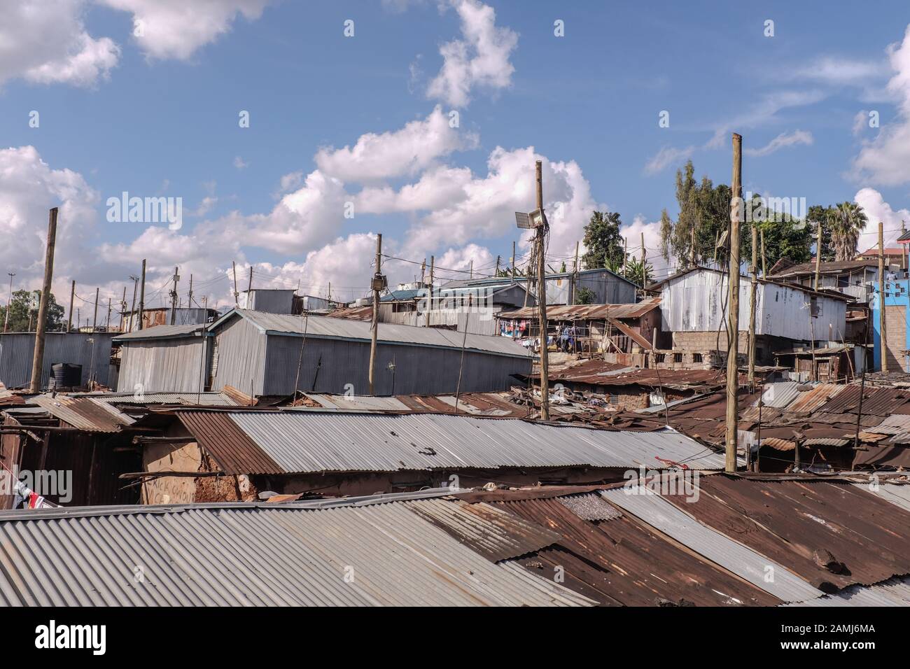 An arrangement of electric poles and empty token meter boxes abandoned