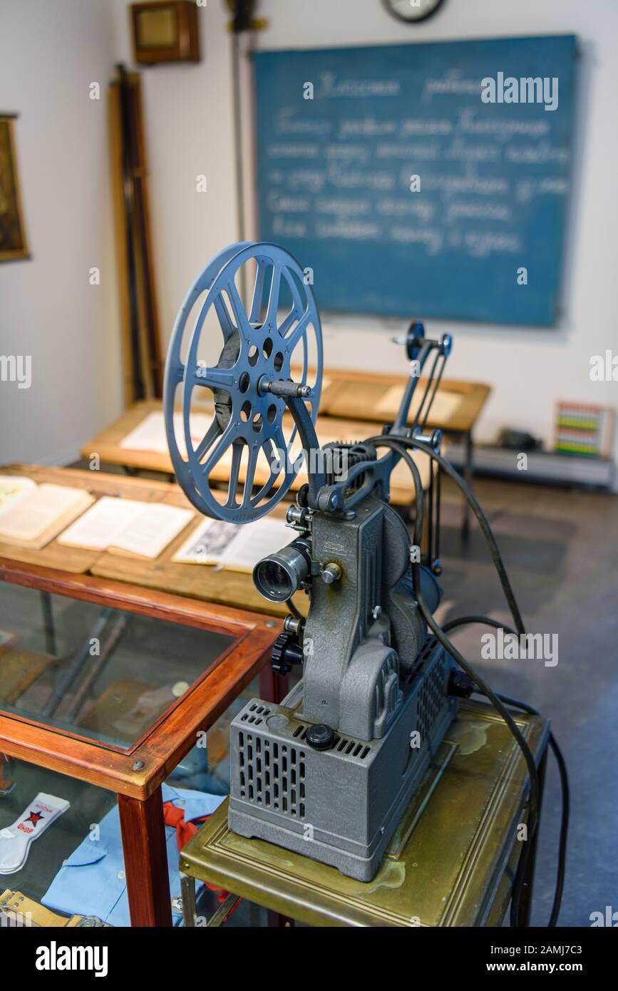 Old fashioned film projector in a soviet communist era classroom Stock Photo