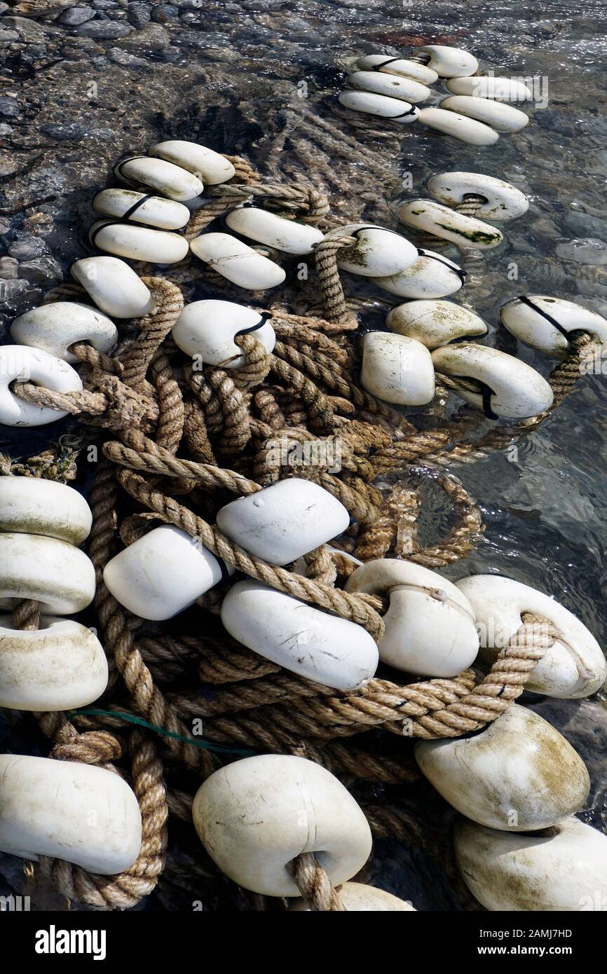fishing net floats laying on shore sizewell suffolk, UK england Stock Photo