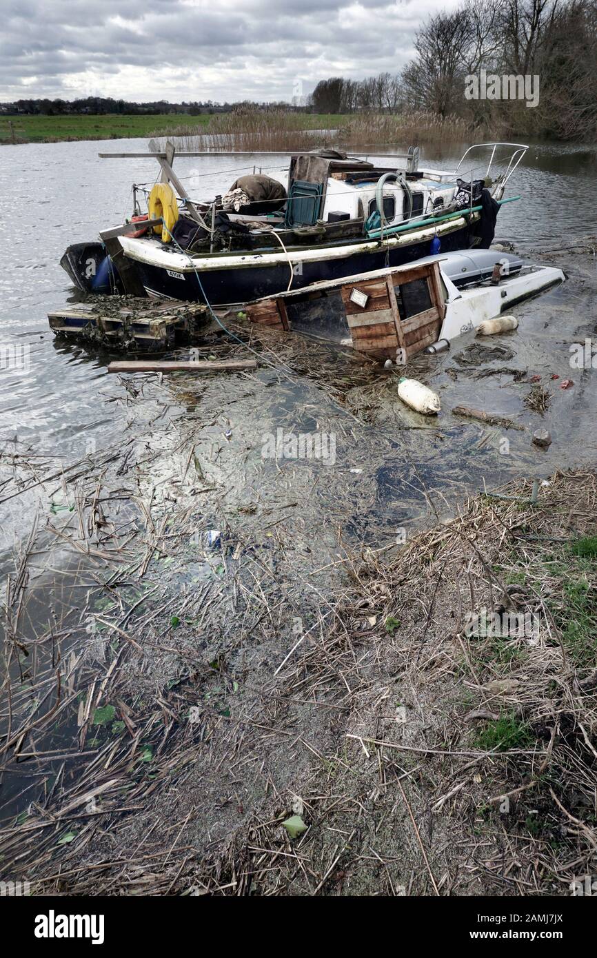 abandoned and sunken  boat geldeston norfolk england UK Stock Photo