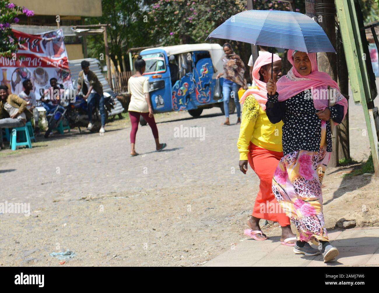 An Ethiopian woman holding an umbrella. Stock Photo