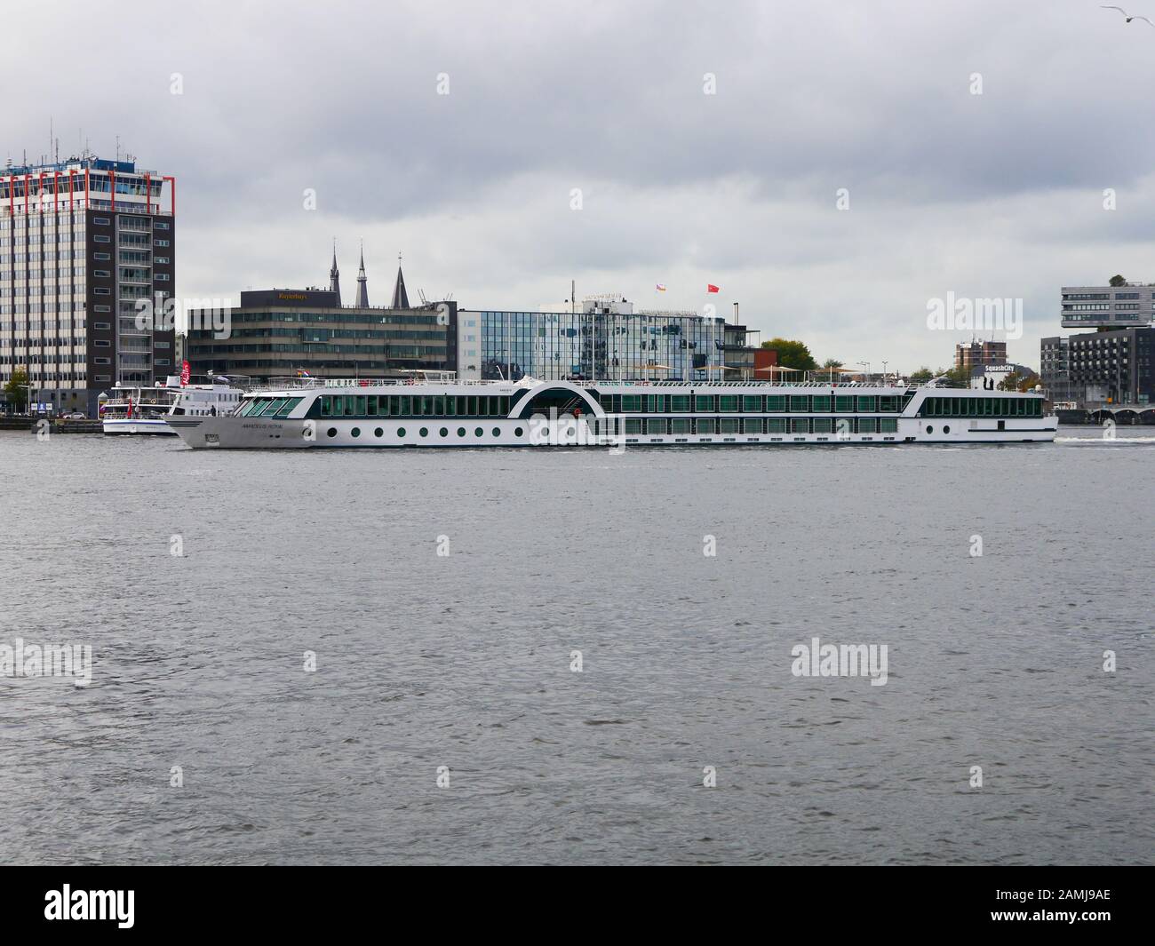 A river cruise boat on the Amstel river, Amsterdam, Netherlands Stock Photo