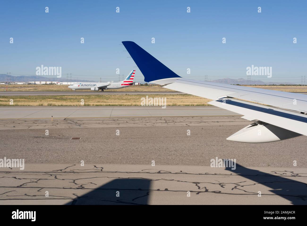 Delta Airlines on runway ready to take off at The Salt Lake City International Airport as seen from an airplane window seat. Stock Photo