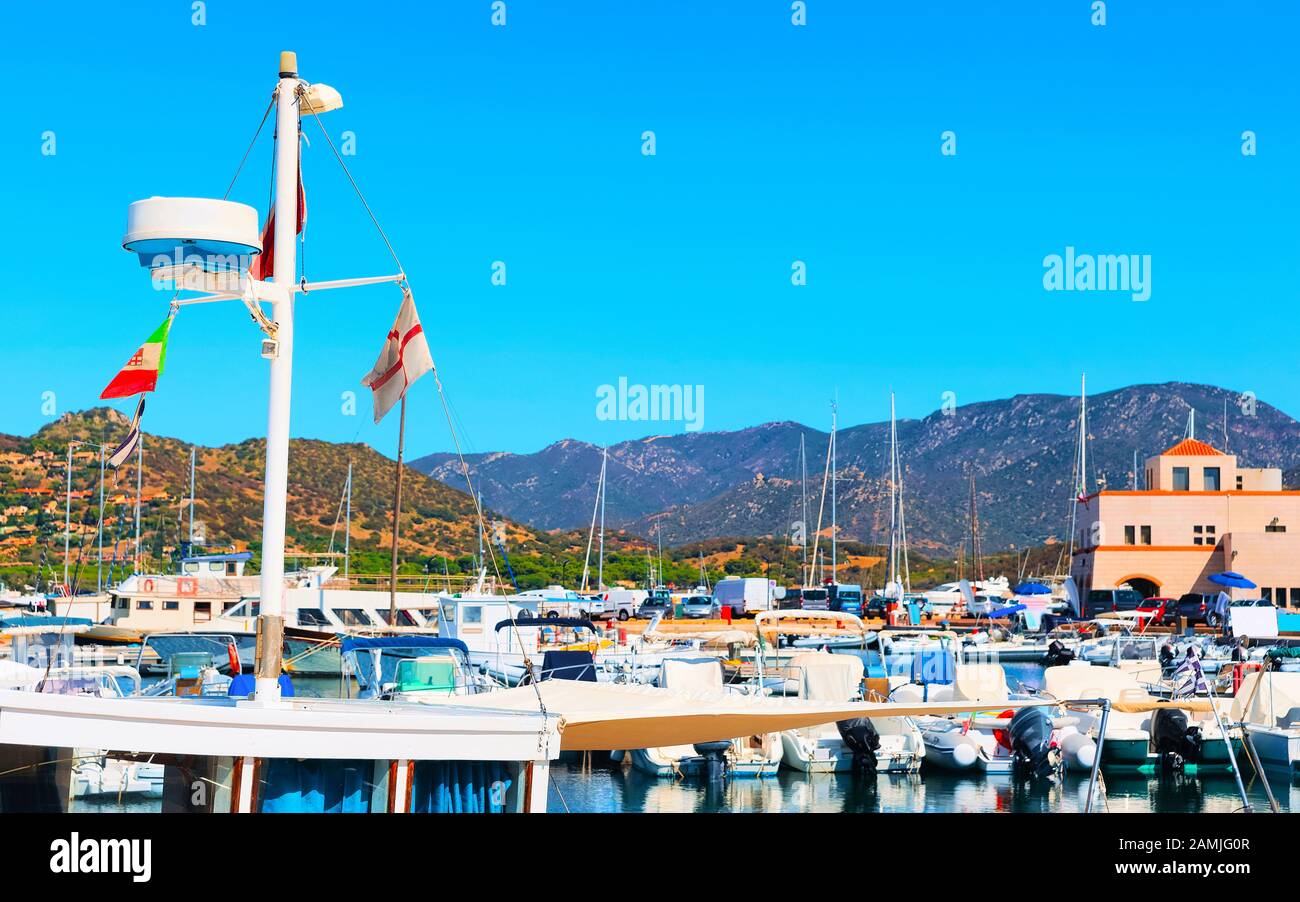 Port with yachts at Villasimius Cagliari South Sardinia reflex Stock Photo