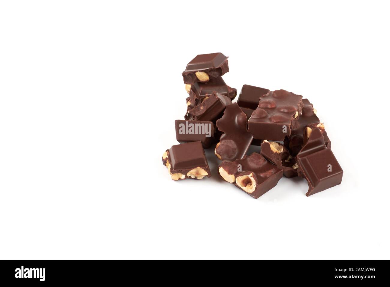 Chocolate pieces with nuts isolated on white background Stock Photo