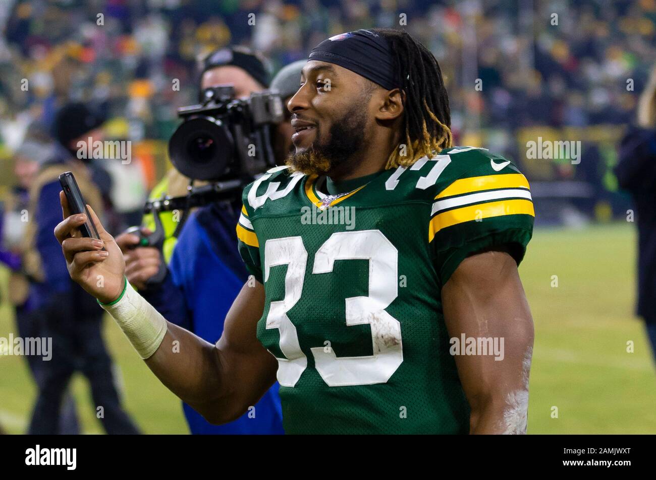 Green Bay, Wisconsin, USA. 22nd Jan, 2022. San Francisco 49ers middle  linebacker Fred Warner (54) tackles Green Bay Packers running back Aaron  Jones (33) during the NFL divisional playoff football game between