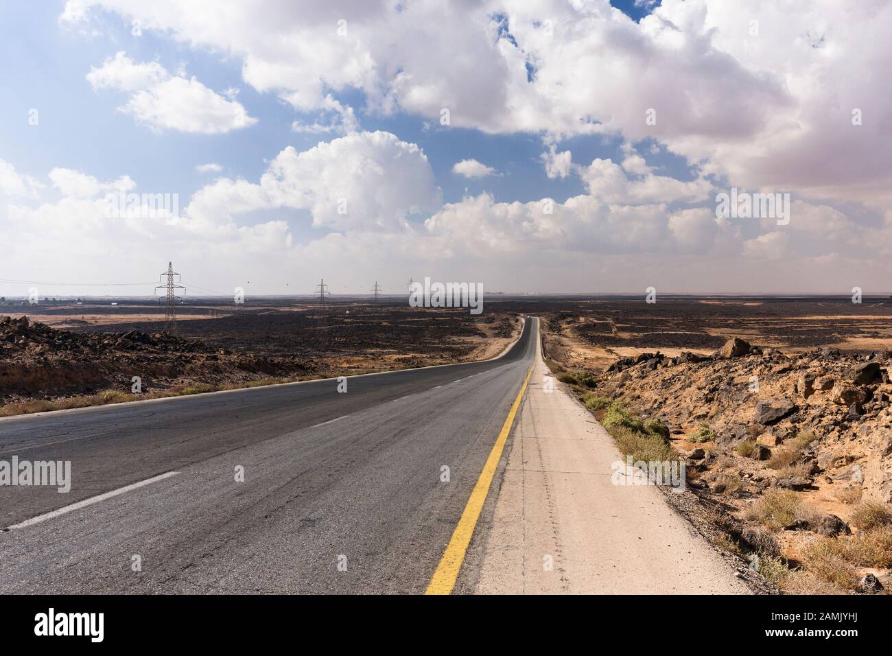 Desert Road, Desert highway, route 5, in basalt gravel desert, near Azraq, eastern desert, Jordan, middle east, Asia Stock Photo