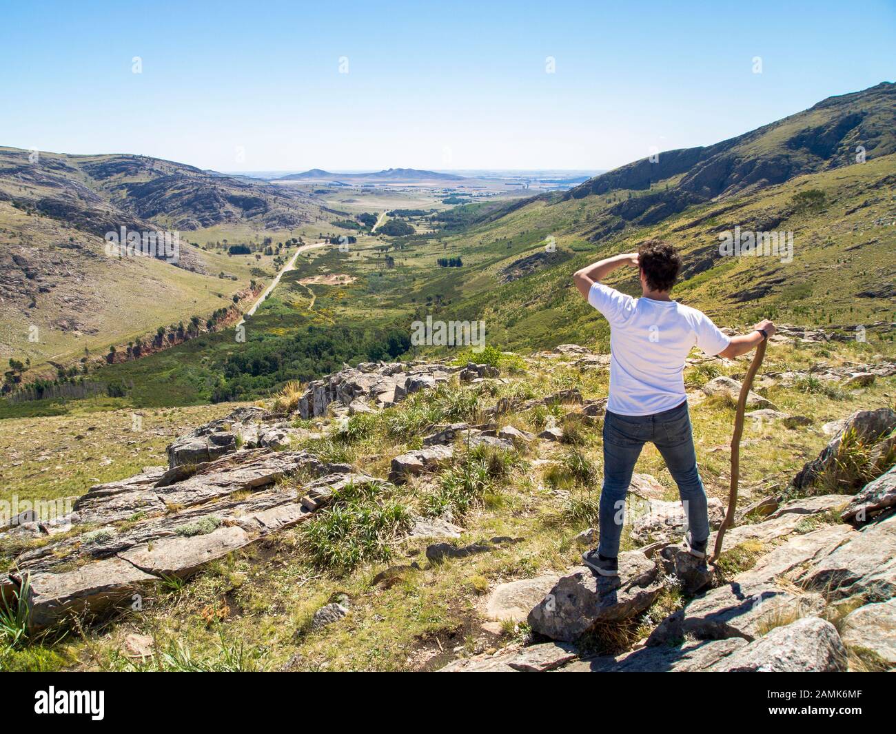 Young hiker looking at the view in Cerro Bahía Blanca, Sierra de la Ventana, Buenos Aires, Argentina. Stock Photo
