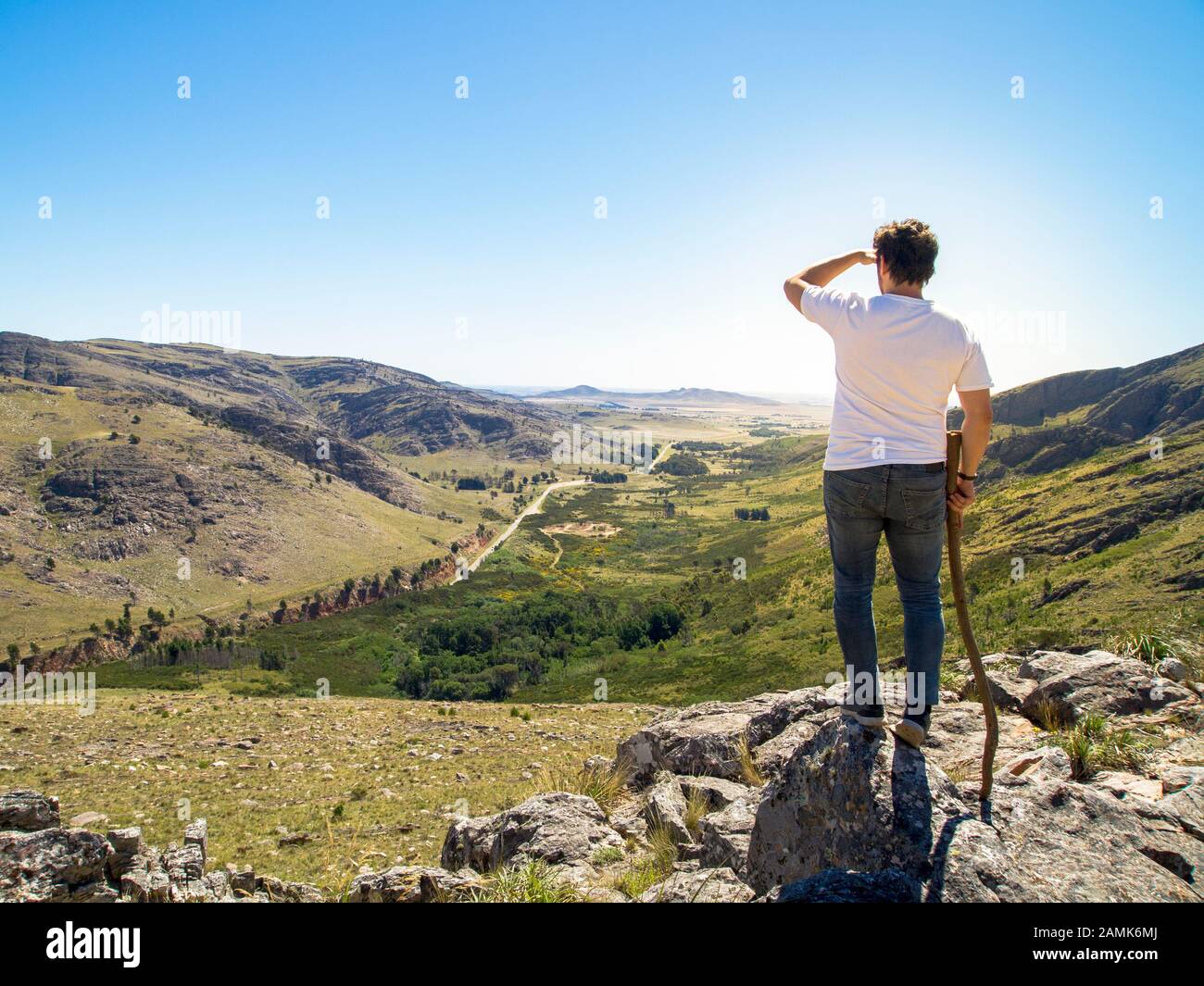Young hiker looking at the view in Cerro Bahía Blanca, Sierra de la Ventana, Buenos Aires, Argentina. Stock Photo
