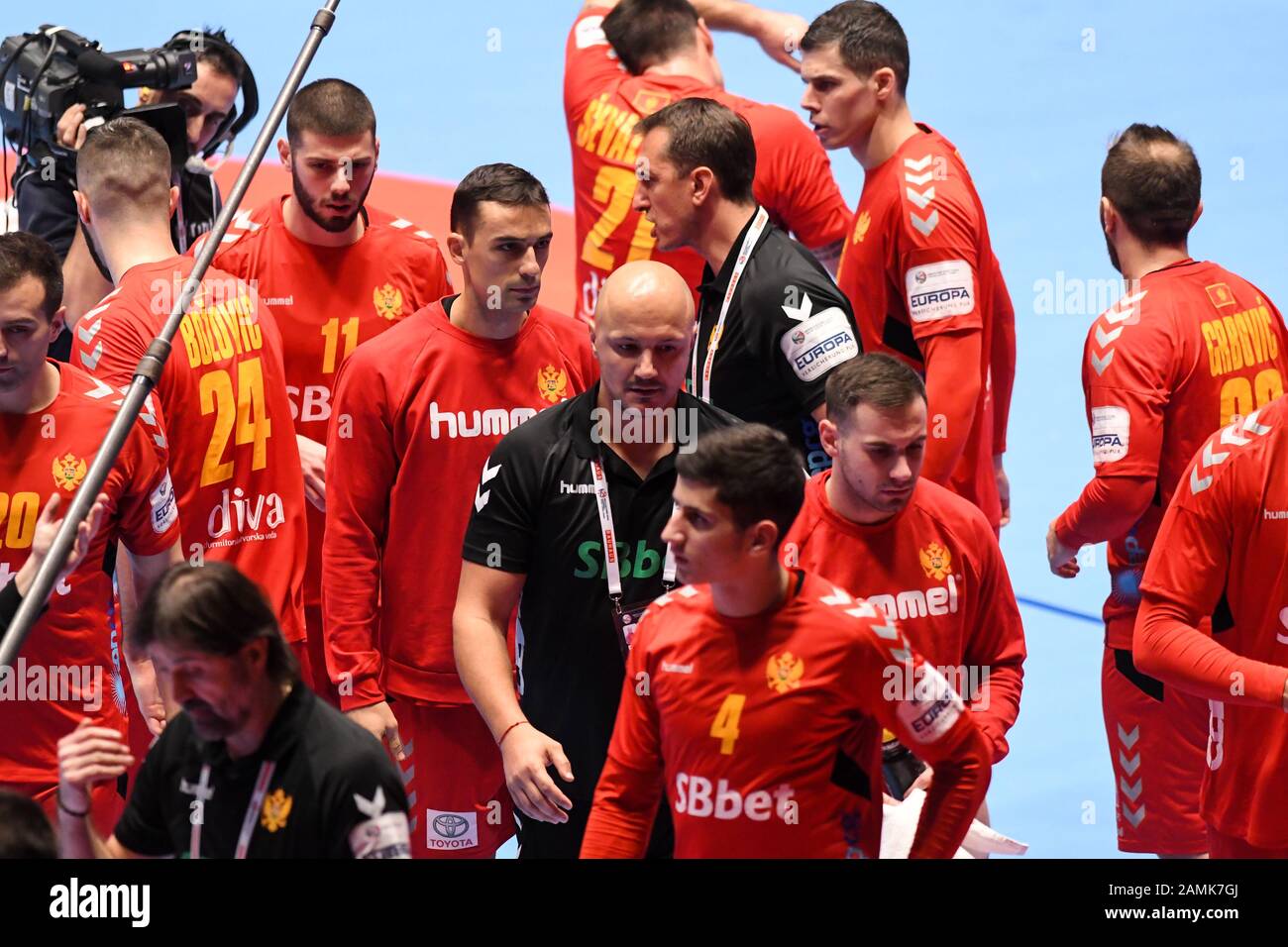 Zoran Roganovic, head coach of Montenegro and his players are seen before  the handball match between National teams of Montenegro and Belarus in  Group A of Men's EHF EURO 2020 in Graz
