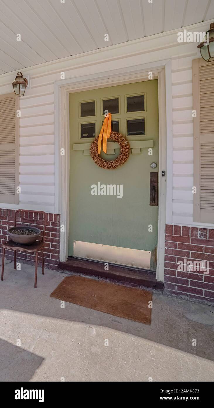 Vertical frame Covered front porch with rocking chairs day light Stock ...