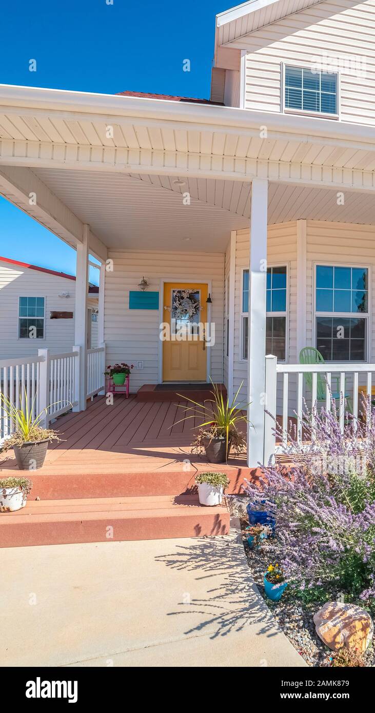 Vertical frame Large covered white porch on a white timber house Stock ...