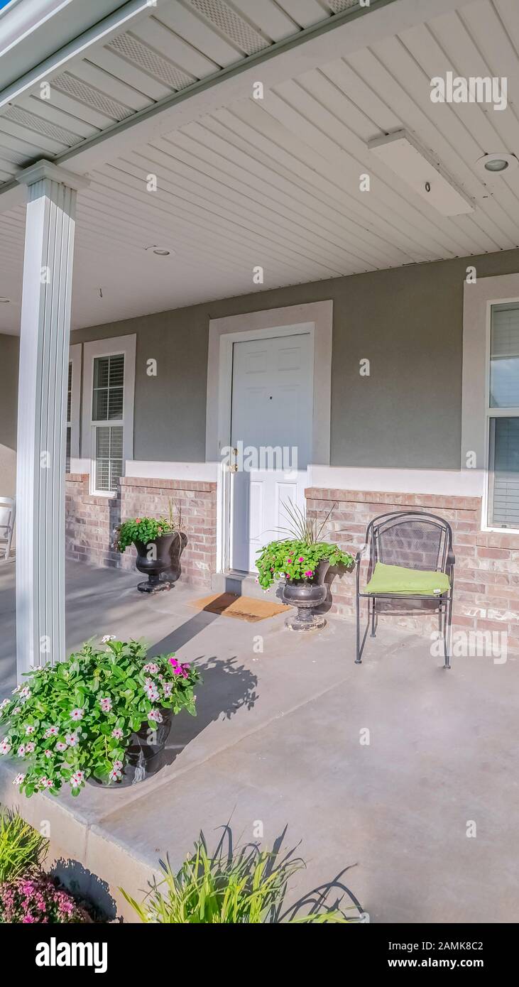 Vertical Covered porch at the front of an urban house Stock Photo - Alamy