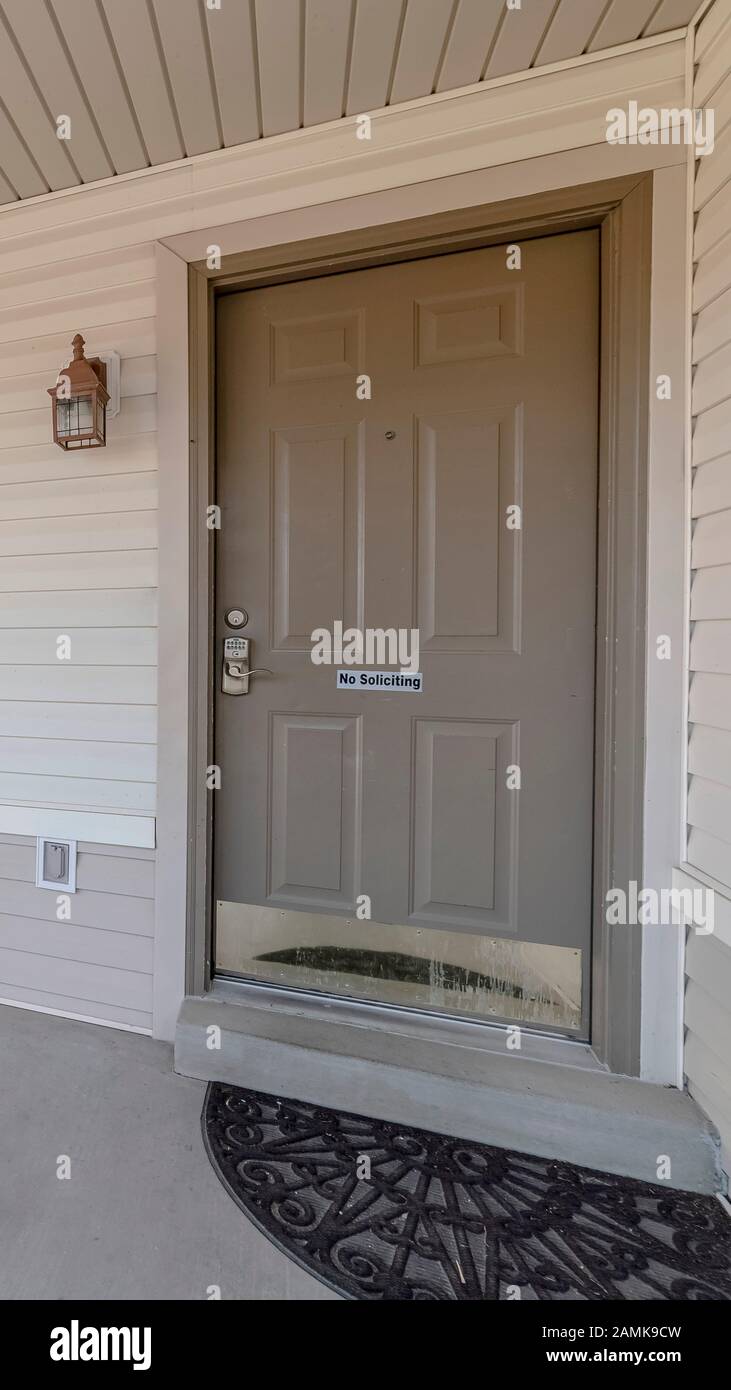Vertical Covered front porch with grey and white decor Stock Photo - Alamy