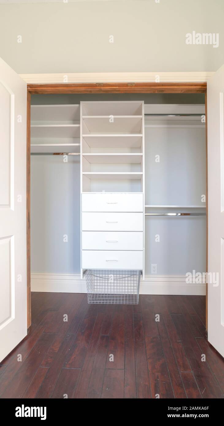 Vertical Interior of an empty walk-in closet in a new house Stock Photo ...