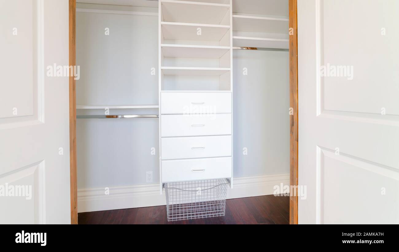Panorama frame Empty shelves of a luxury walk-in closet Stock Photo - Alamy