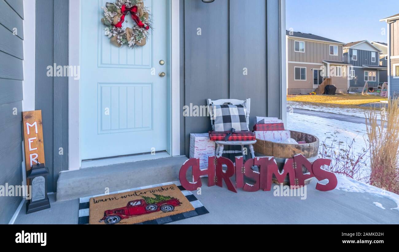 Panorama Christmas Decorations Outside A Front Door Day Light