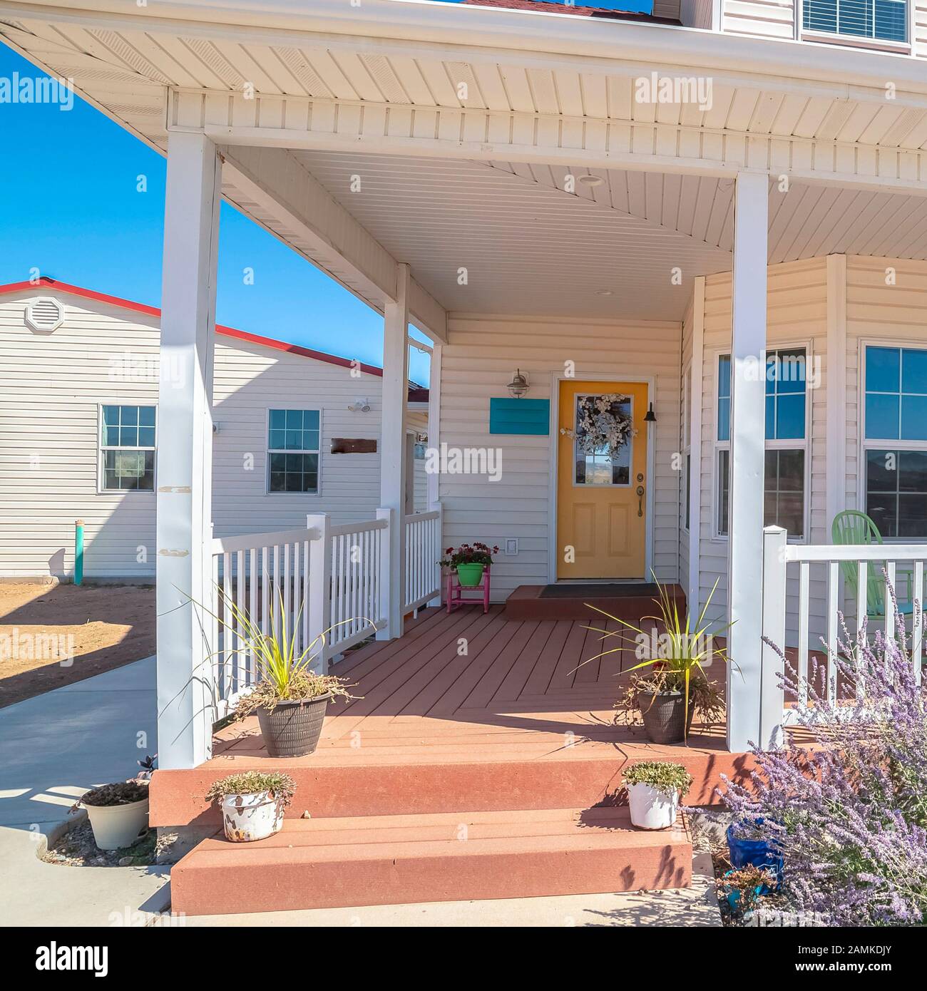 Square frame Large covered white porch on a white timber house Stock ...