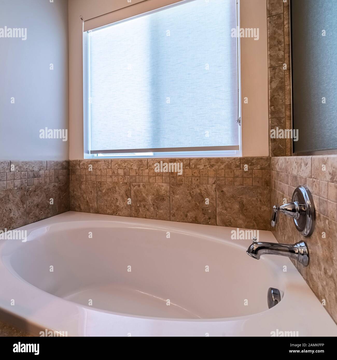 Square frame Small compact spa bath or jacuzzi day light Stock Photo
