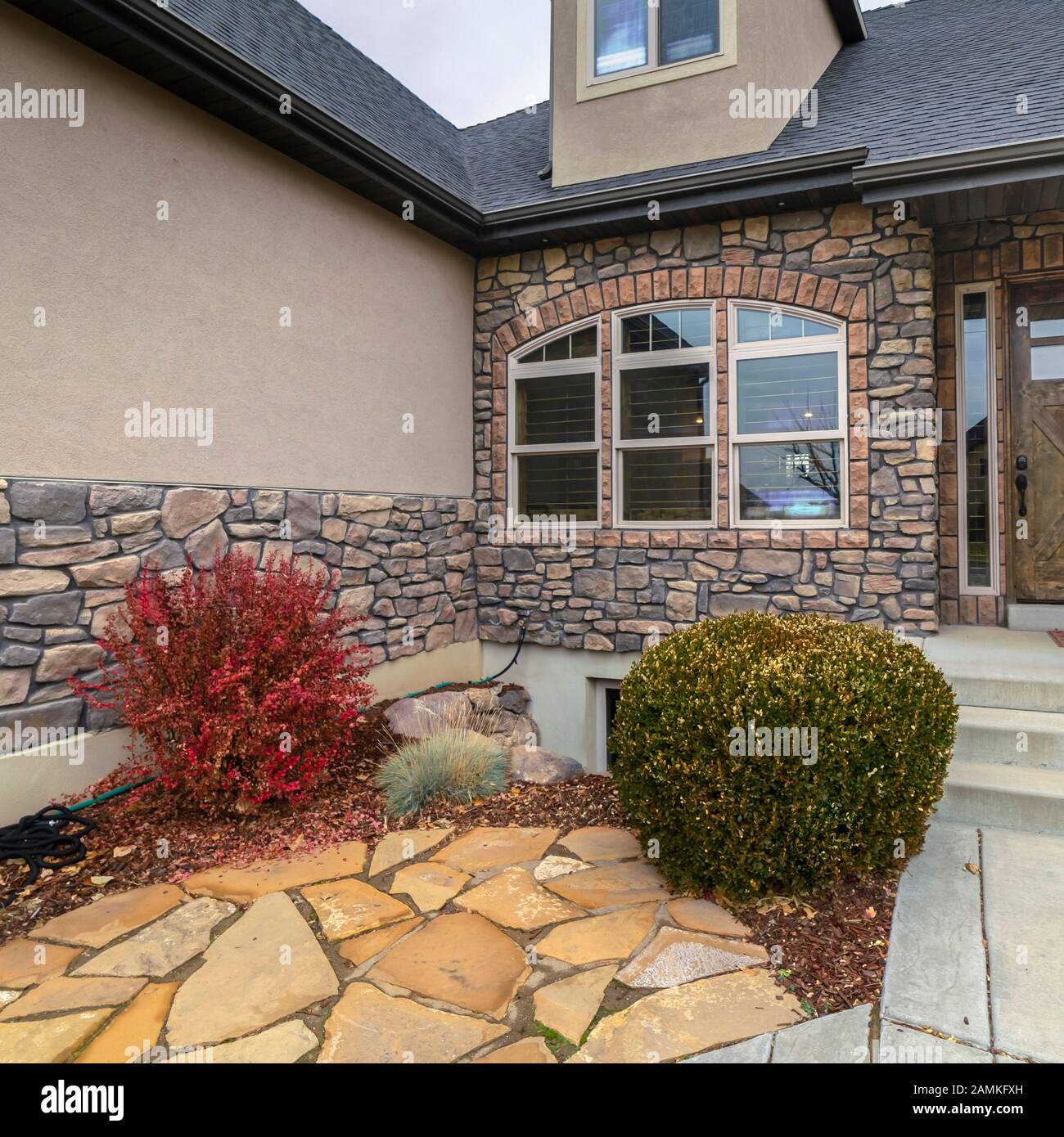 Square frame Modern house with crazy paving landscaping day light Stock ...